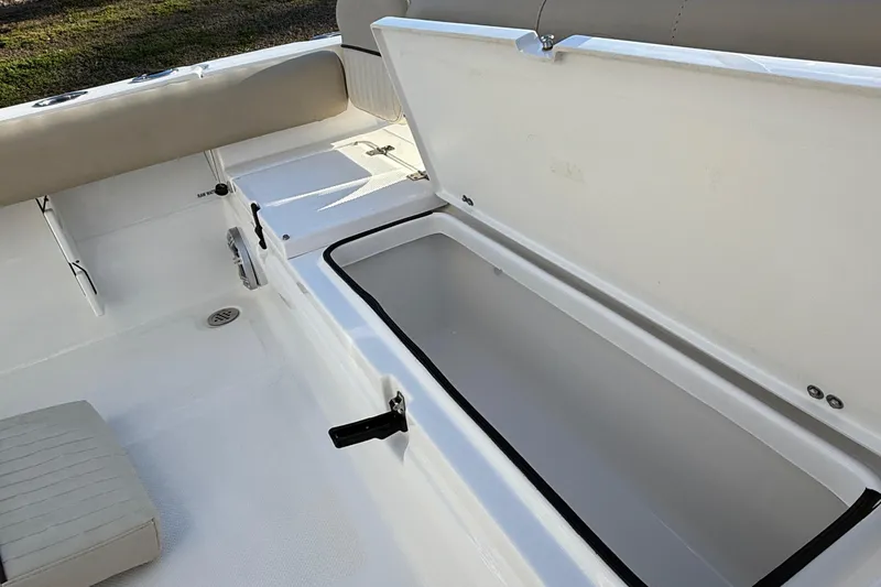 Slide: The Image of 2017 Sea Fox 246 Commander boat storage compartment open, showcasing spacious interior. - 31