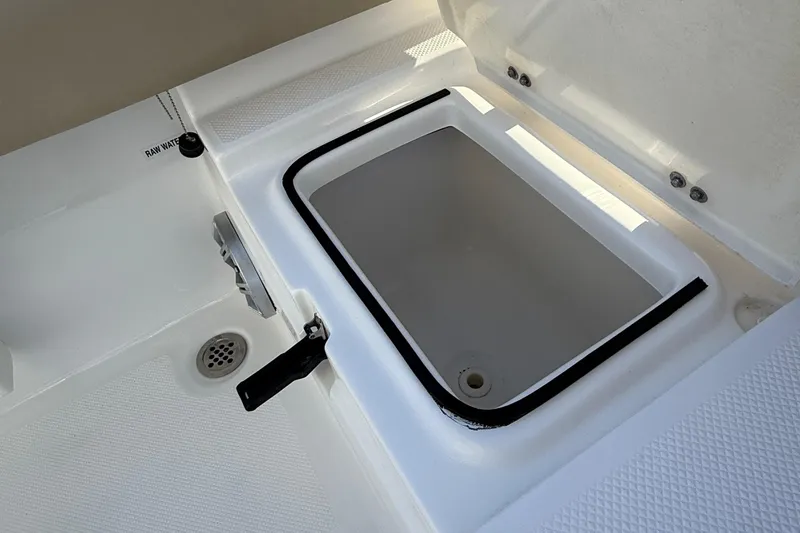 Slide: The Image of 2017 Sea Fox 246 Commander boat storage compartment with open lid. - 32