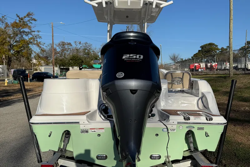 Slide: The Image of 2017 Sea Fox 246 Commander boat with powerful 250 engine, parked outdoors. - 4