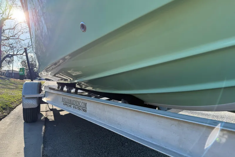 Slide: The Image of 2017 Sea Fox 246 Commander boat on trailer, side view in sunlight. - 7