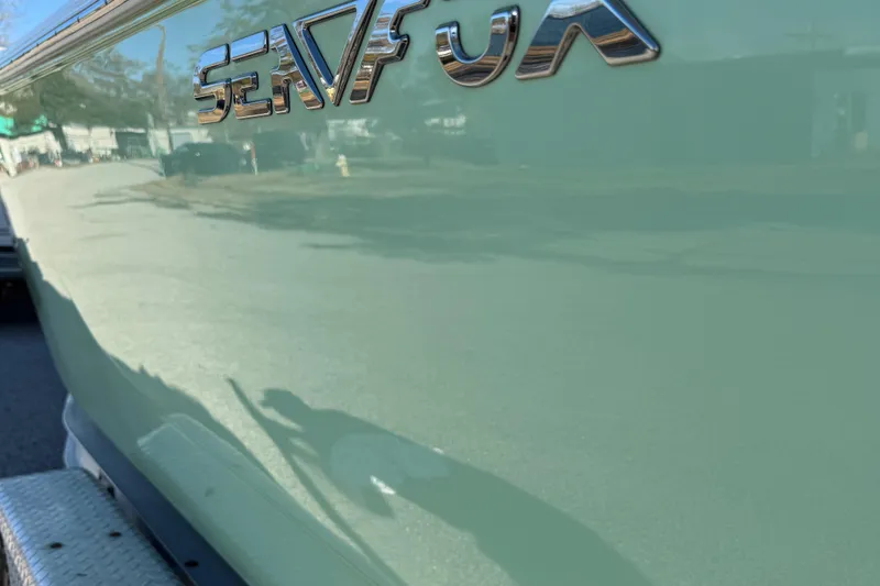 Slide: The Image of 2017 Sea Fox 246 Commander boat side view with logo reflection. - 8