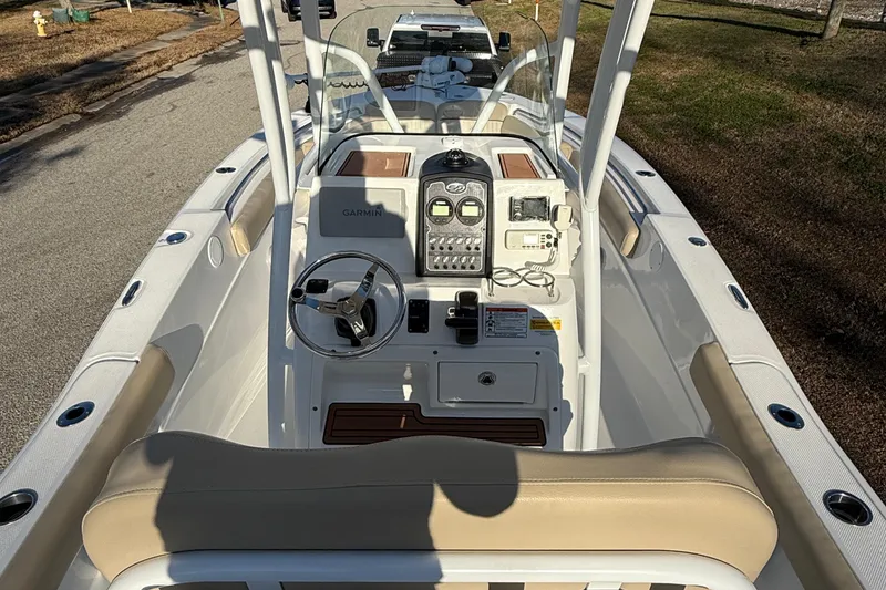 Slide: The Image of 2017 Sea Fox 246 Commander boat interior with steering wheel and control panel. - 9