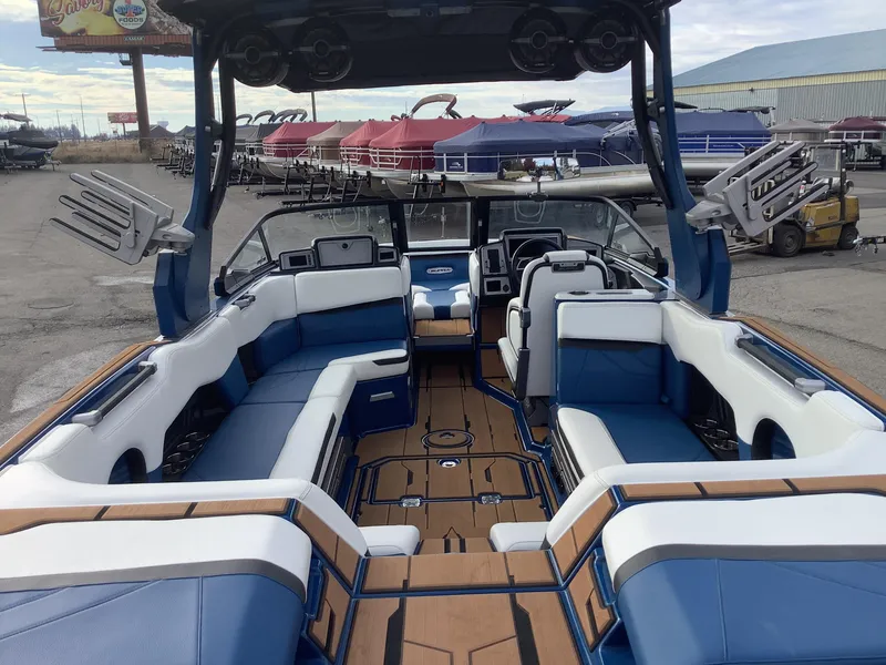 Slide: The Image of 2023 Supra SE interior with blue and white seating. - 11