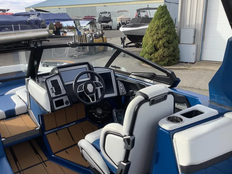 Slide: The Image of 2023 Supra SE interior with blue and white seating. - 15