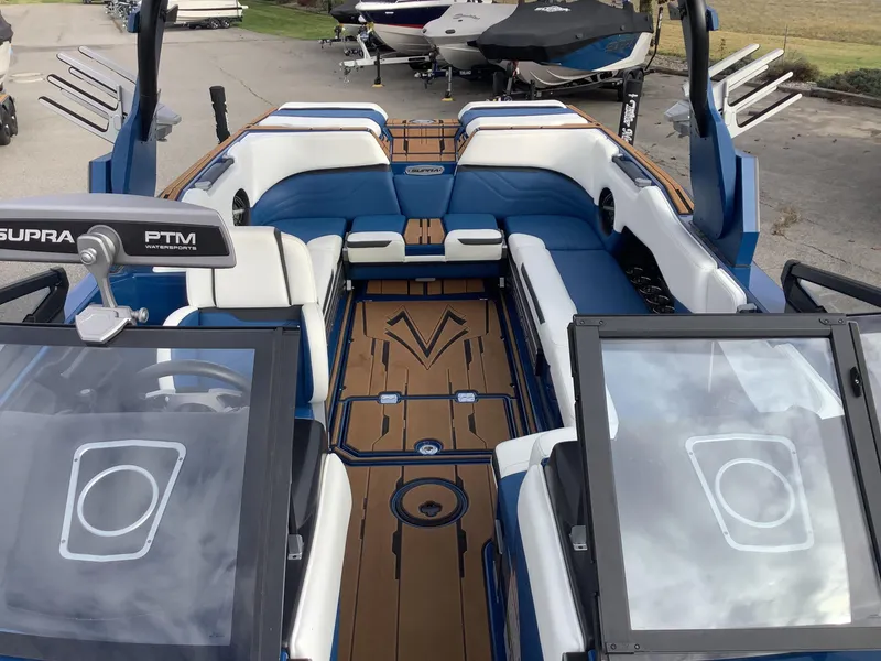 Slide: The Image of Interior of a 2023 Supra SE boat with modern helm. - 26