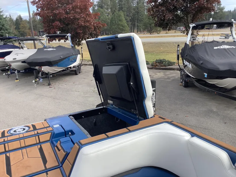 Slide: The Image of 2023 Supra SE boat deck with blue accent design. - 32