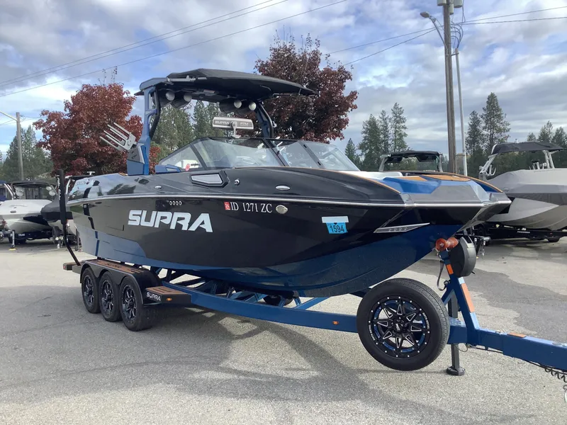 Slide: The Image of 2023 Supra SE boat with blue and white seating. - 5