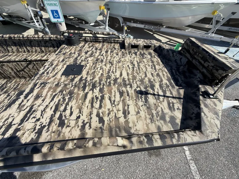Slide: The Image of 2025 Excel Viper F4 boat with camouflage interior, parked on aluminum trailer. - 3