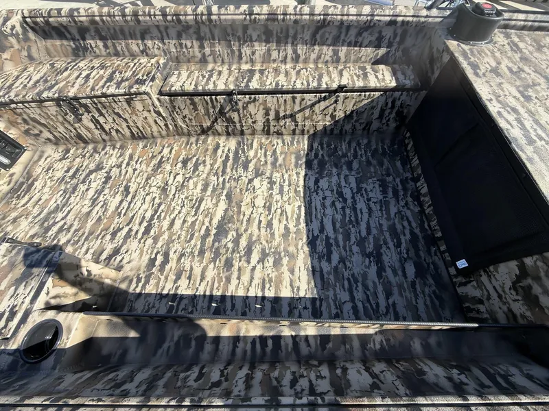 Slide: The Image of 2025 Excel Viper F4 boat interior with camouflage pattern and storage compartments. - 4