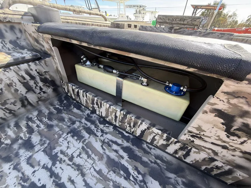 Slide: The Image of 2025 Excel Viper F4 1751 boat interior with fuel tank and camouflage design. - 5
