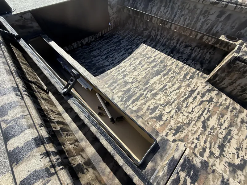Slide: The Image of 2025 Excel Viper F4 1751 boat interior with camouflage design and storage compartment. - 6