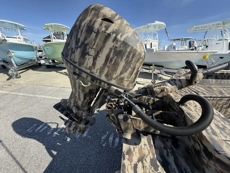 Slide: The Image of 2025 Excel Viper F4 1751 boat with camo design, featuring Yamaha 60HP engine and aluminum trailer. - 7