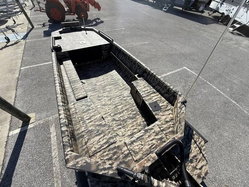 Slide: The Image of 2025 Excel Viper F4 1751 boat with camo design, parked on aluminum trailer. - 8