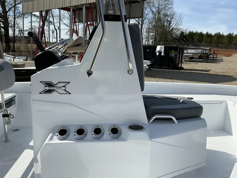 Slide: The Image of 2025 Xpress Hyper-Lift Series H20B boat console, sleek design with rod holders. - 5