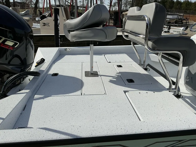 Slide: The Image of 2025 Xpress Hyper-Lift Series H20B boat deck with seating and storage compartments. - 7