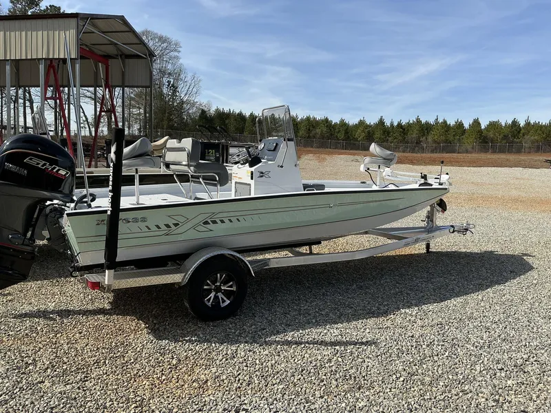 Slide: The Image of 2025 Xpress Hyper-Lift Series H20B boat on trailer, parked outdoors. - 8