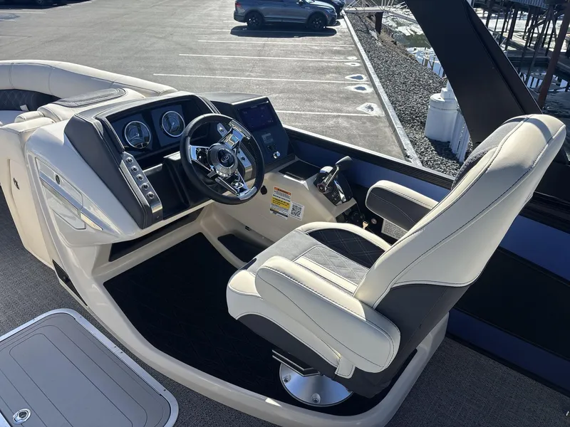 Slide: The Image of 2025 Barletta Lusso L23UC boat helm with modern steering and controls. - 10