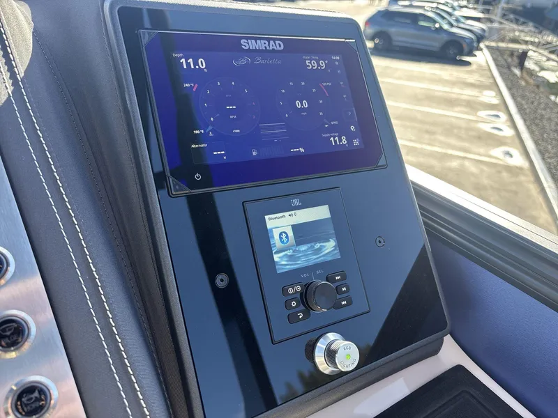 Slide: The Image of Control panel of 2025 Barletta Lusso L23UC boat with Simrad and JBL displays. - 12