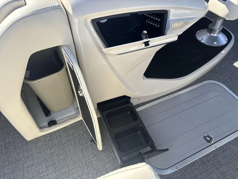 Slide: The Image of 2025 Barletta Lusso L23UC interior with storage compartments and cup holders. - 18