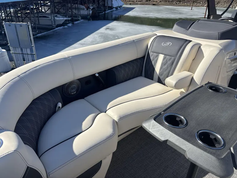Slide: The Image of Luxurious seating on 2025 Barletta Lusso L23UC pontoon boat, featuring elegant upholstery and cup holders. - 9