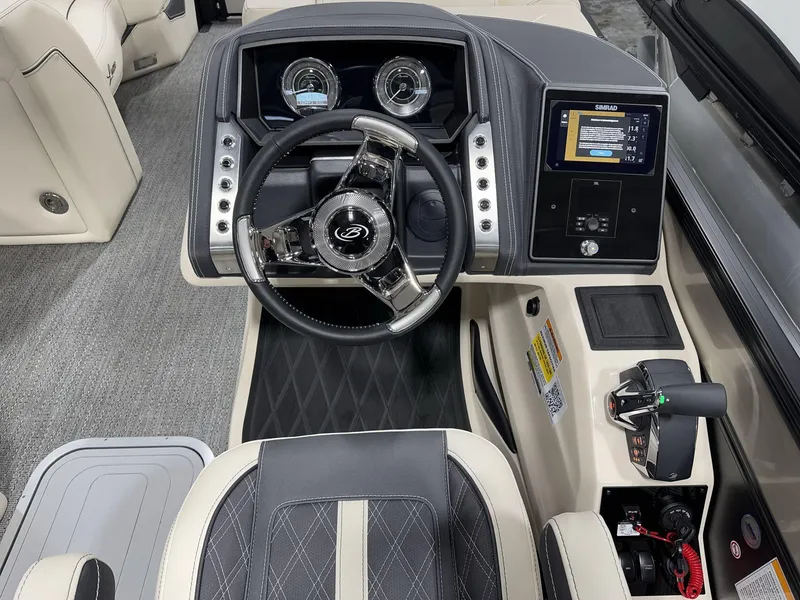 Slide: The Image of 2025 Barletta Lusso L25UEA boat dashboard with steering wheel and control panel. - 11