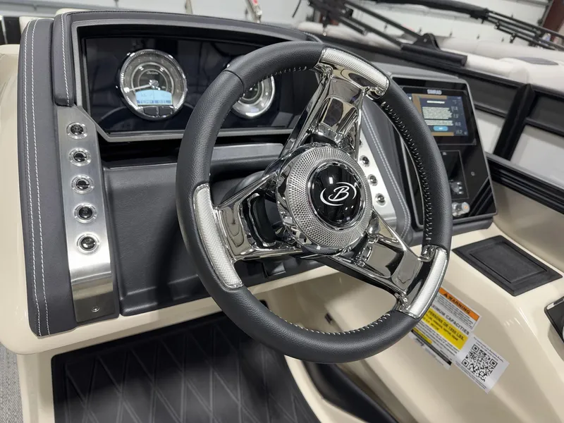 Slide: The Image of 2025 Barletta Lusso L25UEA steering wheel and dashboard, featuring modern controls and displays. - 12