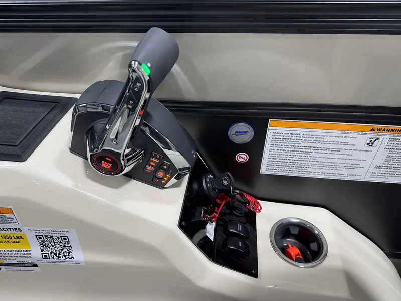 Slide: The Image of Control panel of 2025 Barletta Lusso L25UEA boat with start-stop button and safety warnings. - 13