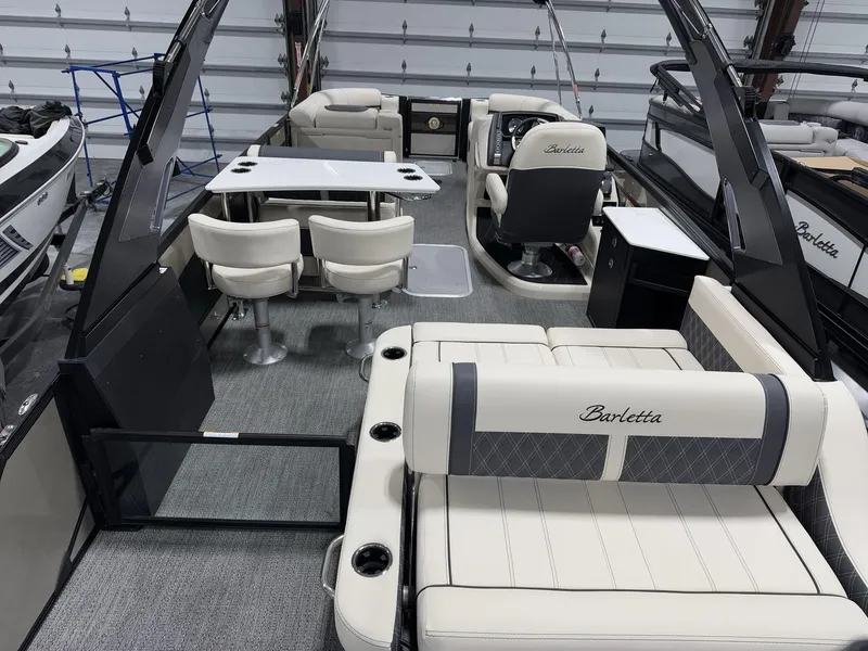 Slide: The Image of 2025 Barletta Lusso L25UEA pontoon boat interior with luxurious seating and modern design. - 7