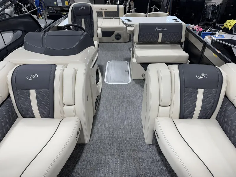 Slide: The Image of 2025 Barletta Lusso L25UEA pontoon boat interior with luxurious seating and modern design. - 9