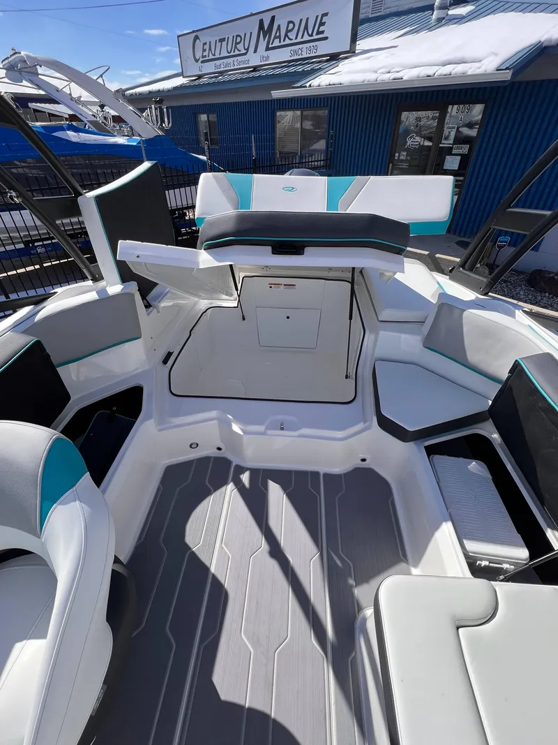 Slide: The Image of 2023 Regal 21 OBX boat interior with seating and storage, displayed at Century Marine. - 13