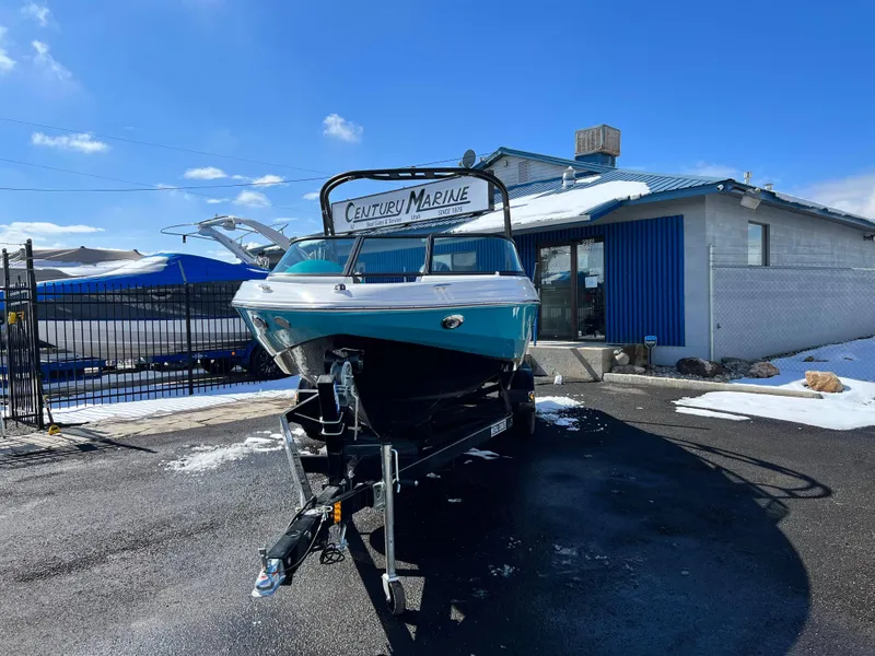 Slide: The Image of 2023 Regal 21 OBX boat on trailer at Century Marine dealership. - 3