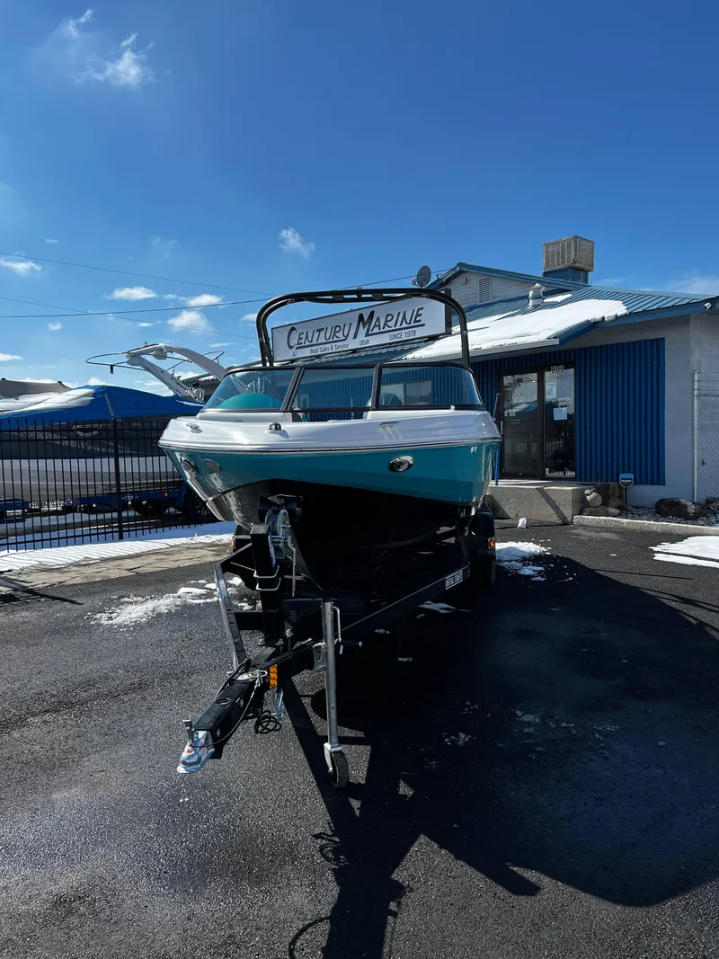 Slide: The Image of 2023 Regal 21 OBX boat on trailer at Century Marine dealership. - 5