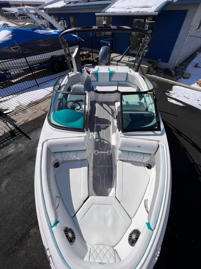 Slide: The Image of 2023 Regal 21 OBX boat with sleek white interior and modern design. - 6
