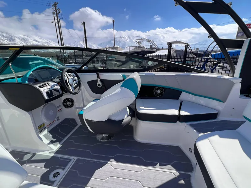 Slide: The Image of 2023 Regal 21 OBX boat interior with modern seating and dashboard design. - 7