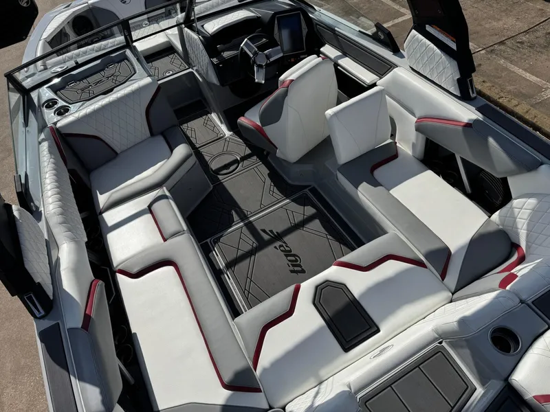 Slide: The Image of 2023 Tigé 22RZX boat interior with luxurious seating and modern dashboard design. - 10