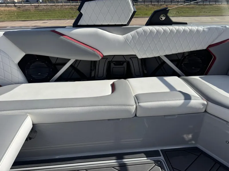 Slide: The Image of 2023 Tigé 22RZX boat interior with white quilted seats and modern design. - 13
