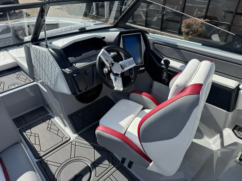 Slide: The Image of 2023 Tigé 22RZX boat interior with modern dashboard and steering wheel. - 16