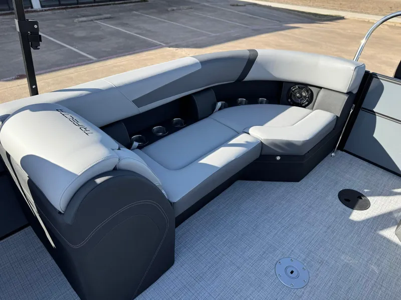 Slide: The Image of Luxurious seating on 2025 Trifecta 24RF CS 3.0 pontoon boat, featuring sleek design and cup holders. - 13