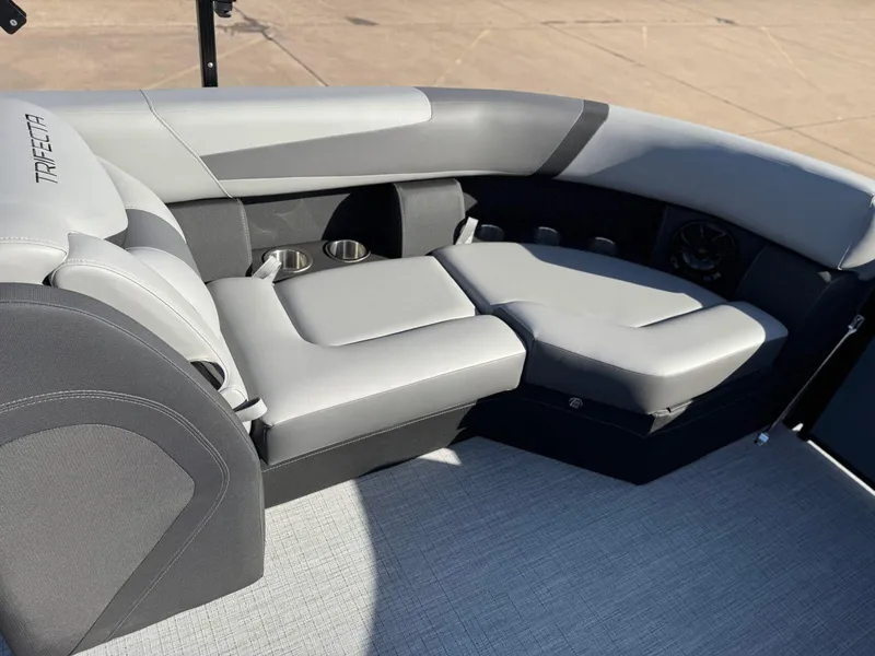 Slide: The Image of Luxurious seating on 2025 Trifecta 24RF CS 3.0 pontoon boat, featuring sleek gray upholstery. - 5
