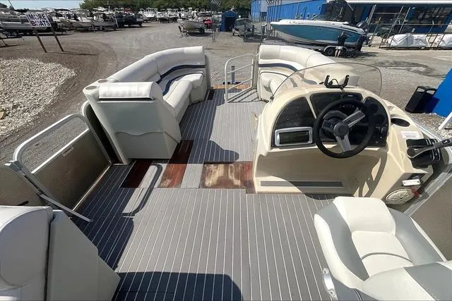 Slide: The Image of 2016 Sweetwater SW 2286 pontoon boat interior with seating and steering console. - 10