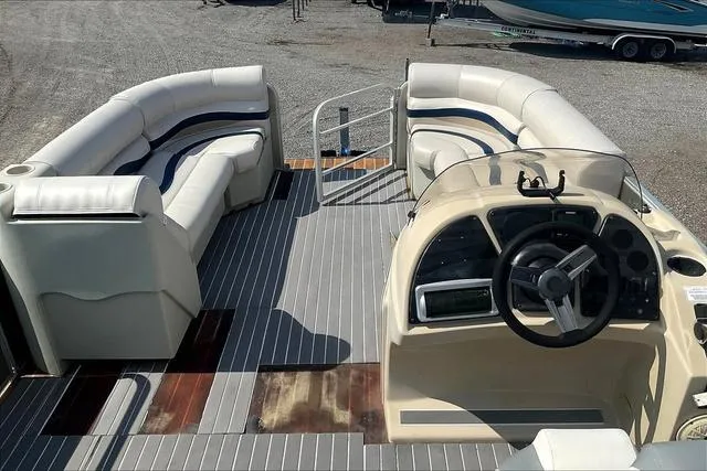 Slide: The Image of 2016 Sweetwater SW 2286 pontoon boat with spacious seating and modern helm. - 11