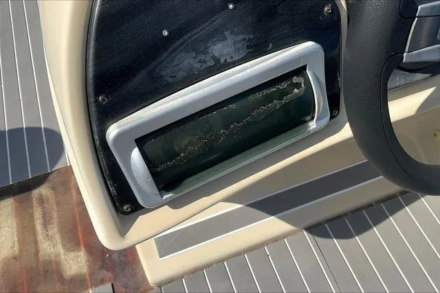 Slide: The Image of Dashboard of a 2016 Sweetwater SW 2286 boat with a weathered gauge. - 18