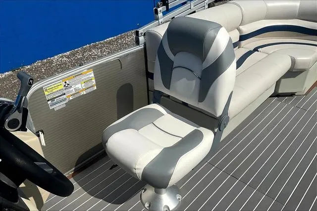 Slide: The Image of 2016 Sweetwater SW 2286 boat interior with gray and white seating. - 20