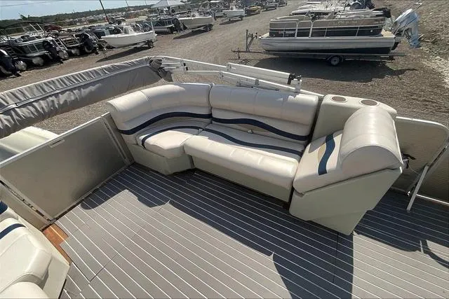 Slide: The Image of 2016 Sweetwater SW 2286 pontoon boat interior with cushioned seating and cup holders. - 22