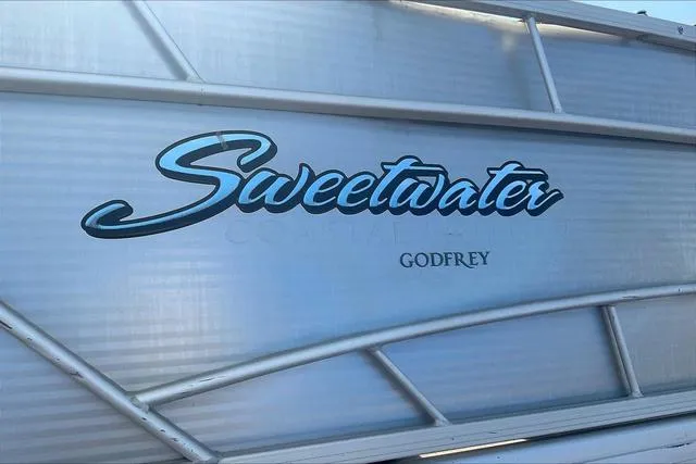 Slide: The Image of Sweetwater SW 2286 2016 boat logo on metallic surface. - 25