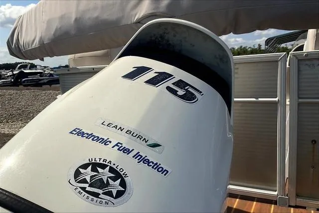 Slide: The Image of Outboard motor on 2016 Sweetwater SW 2286 boat, featuring lean burn and electronic fuel injection. - 26