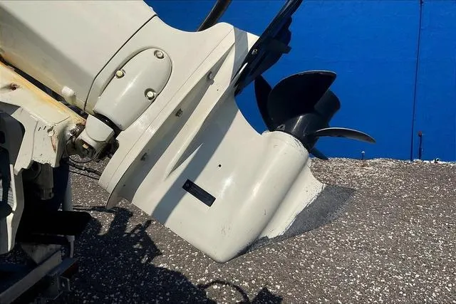 Slide: The Image of Close-up of a 2016 Sweetwater SW 2286 boat motor against a blue background. - 28