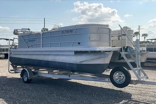 Slide: The Image of 2016 Sweetwater SW 2286 pontoon boat on trailer, parked outdoors. - 3