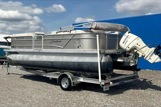 Slide: The Image of 2016 Sweetwater SW 2286 pontoon boat on trailer, parked outdoors. - 5