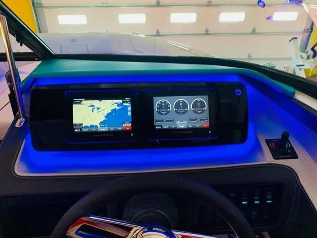 Slide: The Image of Dashboard of 2022 Regal LS6 boat with navigation and control screens. - 5
